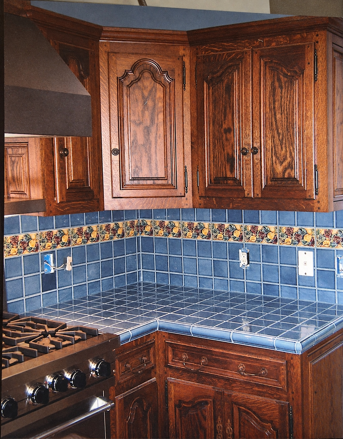 A closer look at the shaped cabinet doors and wood grain in the kitchen.