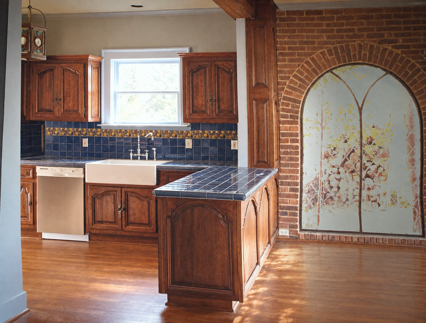Custom antique-inspired kitchen cabinetry with shaped wood doors and farmhouse sink